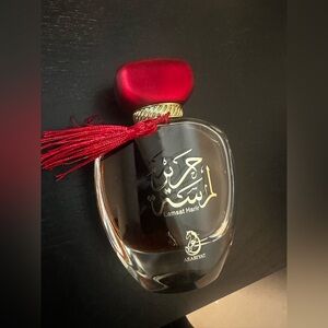 ARABIYAT LAMSAT HARIR Elegant Red and Gold Home Accent Perfume Bottle